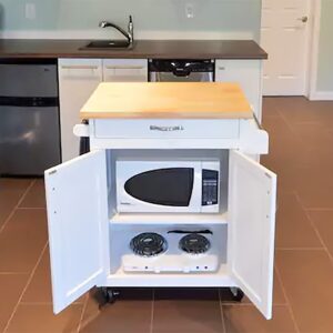Rolling kitchen island cart with microwave and hotplate stored inside