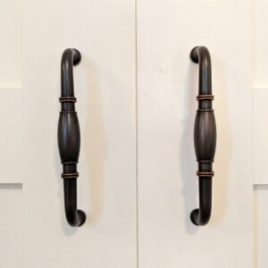 Brass closet handles on cream French closet doors