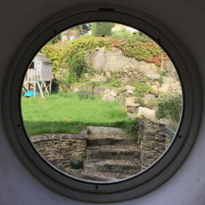 Circle window in Airbnb in Nailsworth, England
